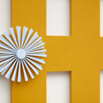 orange criss cross wall sculpture