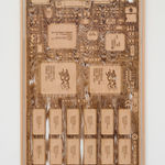 a laser sculpted wood sculpture on a white wall