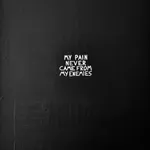 A wide-angle shot of the artwork "My pain never came from my enemies," showing how light emphasizes the physical depth and raw texture of the black and white painted surface.