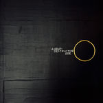 A wide-angle shot of the artwork "A Self Destructive Side," showing how light reflects off the textured black surface and the subtle sheen of the golden-yellow circle.