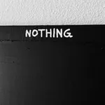 A close-up detail focusing on the word "NOTHING," highlighting the raw, impasto texture of the white paint and the physical depth of the underlying black medium.