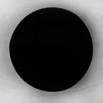 A minimalist black and white composition titled "The Passage," featuring a large, solid black circle centered against a textured, light-colored background with a soft horizontal horizon line.
