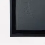 A front-facing view of the artwork in its custom black floater frame, emphasizing the shadow gap between the canvas and the wood.