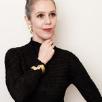 sculptural bracelet - twist - in bimetal, worn with smaller Man Ray Spirals sculptural earrings - sculptural jewellery by artist jeweller Ute Decker