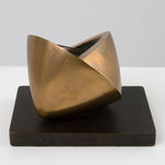 small bronze sculpture with a green inside