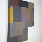 Six-sided shaped acrylic painting divided into rectangular parcels of muted yellows, greens, blues, and purples with a faint grid overlaid