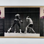 Three gelatin silver print images, left a portrait of Larry Lee, right Clyde Vaugn, center a black and white image of the two boxing. Underneath the portraits are interview transcripts.
