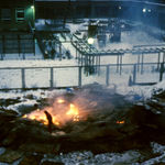 Photo of a small bonfire outside in the winter