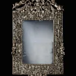 A HIGHLY IMPORTANT CHARLES II CARVED AND SILVERED MIRROR, ENGLISH, CIRCA 1685