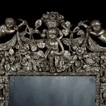 A HIGHLY IMPORTANT CHARLES II CARVED AND SILVERED MIRROR, ENGLISH, CIRCA 1685