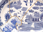 PAUL SCOTT

Cumbrian Blue(s), Fukushima No.11, 04/04/11/24, 2025

Transfer print collage on broken and re-assembled willow pattern platter, marked Japan (c.1965) with Kintsugi

13.75&amp;quot; H &amp;times; 18&amp;quot; W &amp;times; 1.5&amp;quot; D