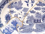 PAUL SCOTT

Cumbrian Blue(s), Fukushima No.11, 04/04/11/24, 2025

Transfer print collage on broken and re-assembled willow pattern platter, marked Japan (c.1965) with Kintsugi

13.75&amp;quot; H &amp;times; 18&amp;quot; W &amp;times; 1.5&amp;quot; D