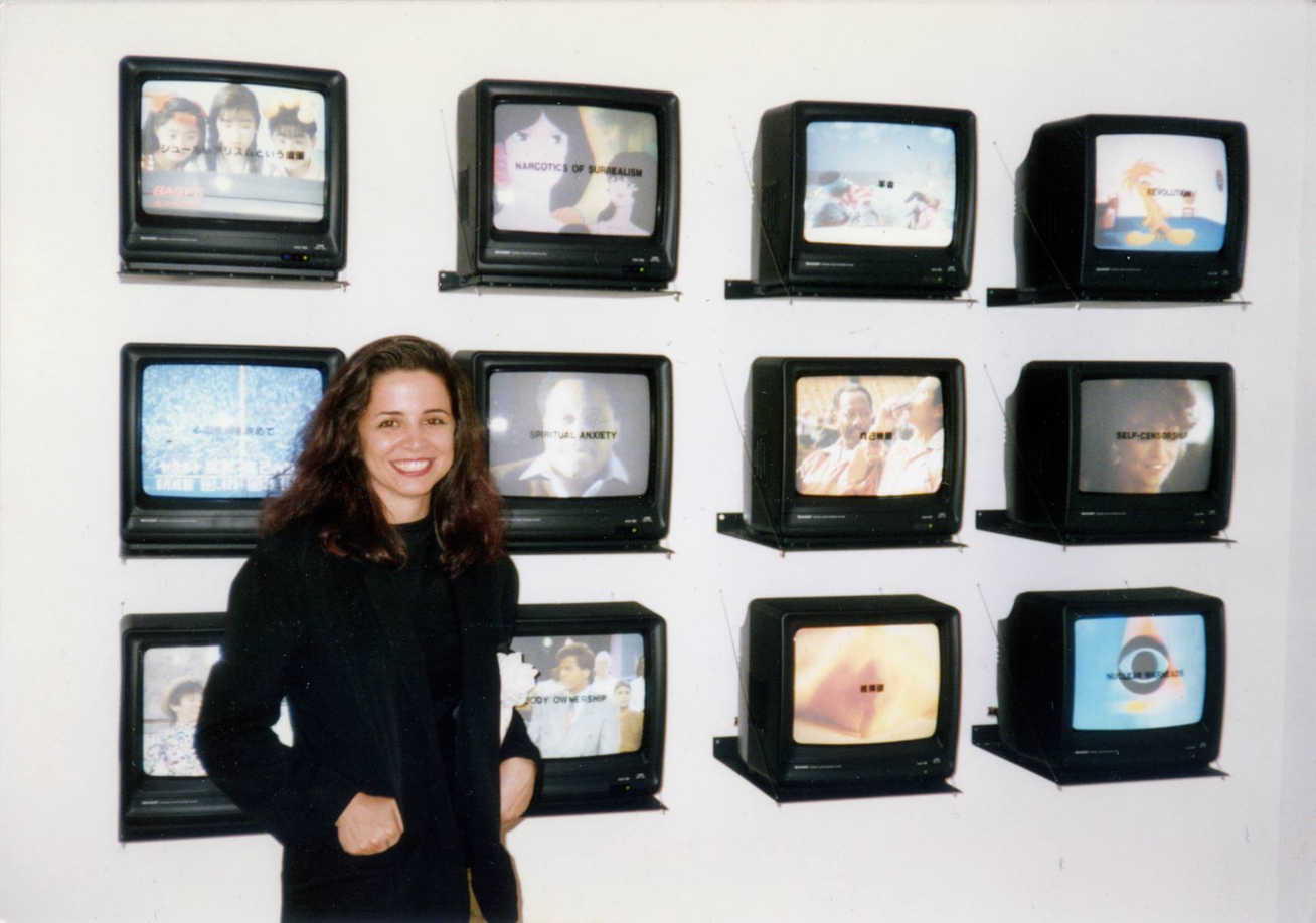 Gretchen Bender with her piece at the Setagaya Museum, Japan, 1991. Courtesy of balanelcher.com.