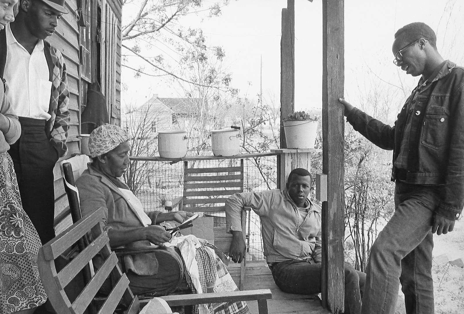 Danny Lyon, Charles Sherrod and Randy Battle visit a supporter in the Georgia countryside, 1963