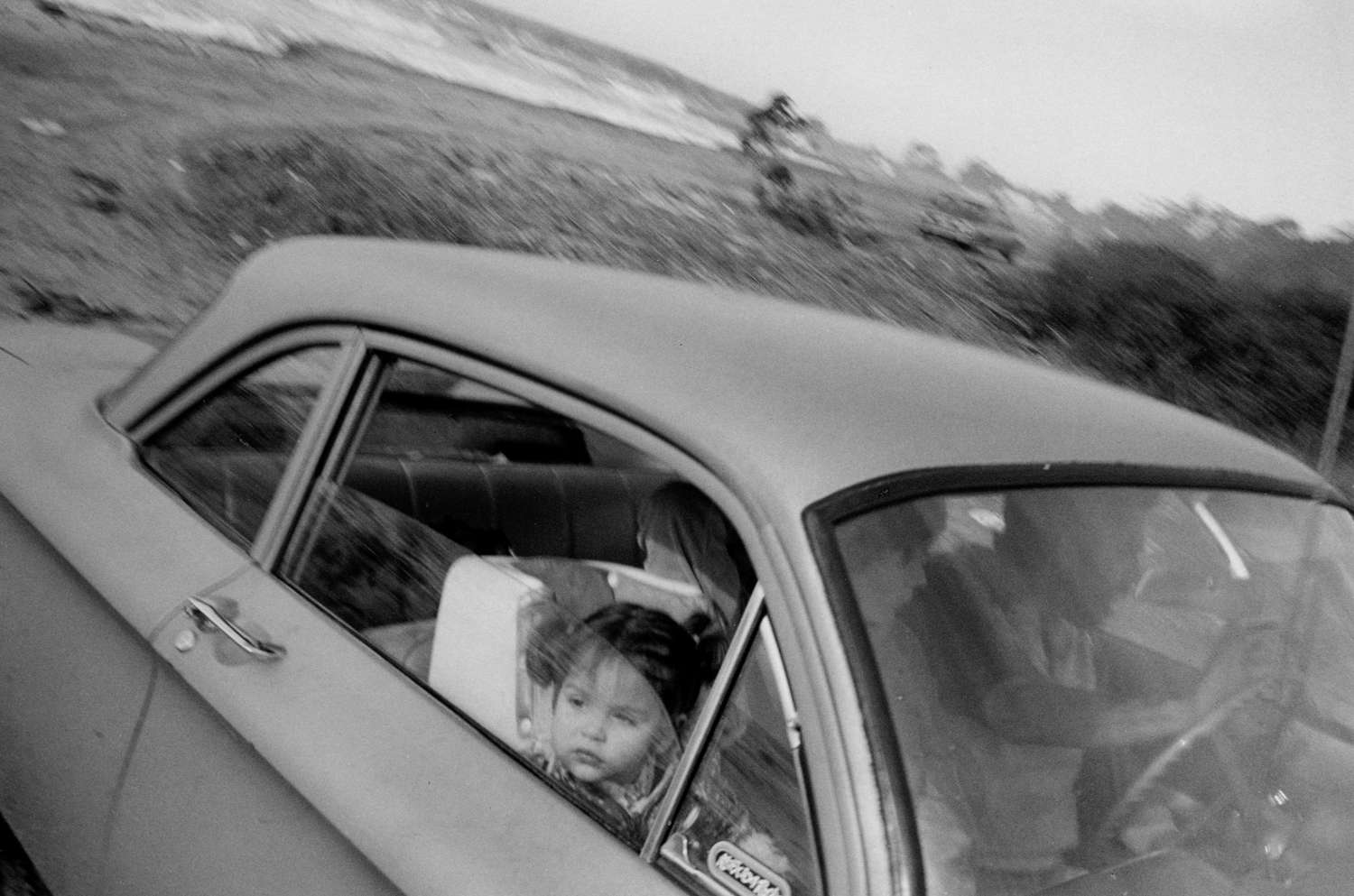 Mark Steinmetz, Pacific Coast Highway, California (Girl Looking Out Window), 1983