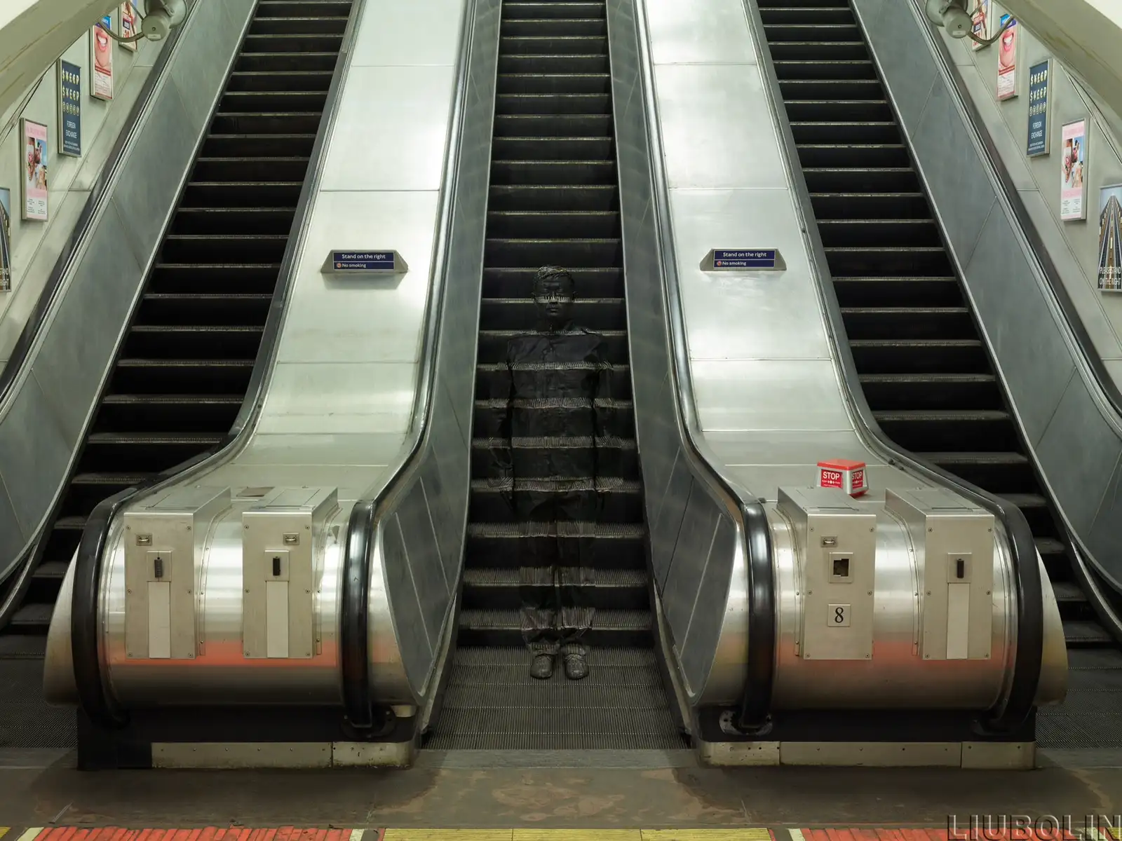 Liu Bolin, Hiding in London No. 3, Underground Escalators, 2014