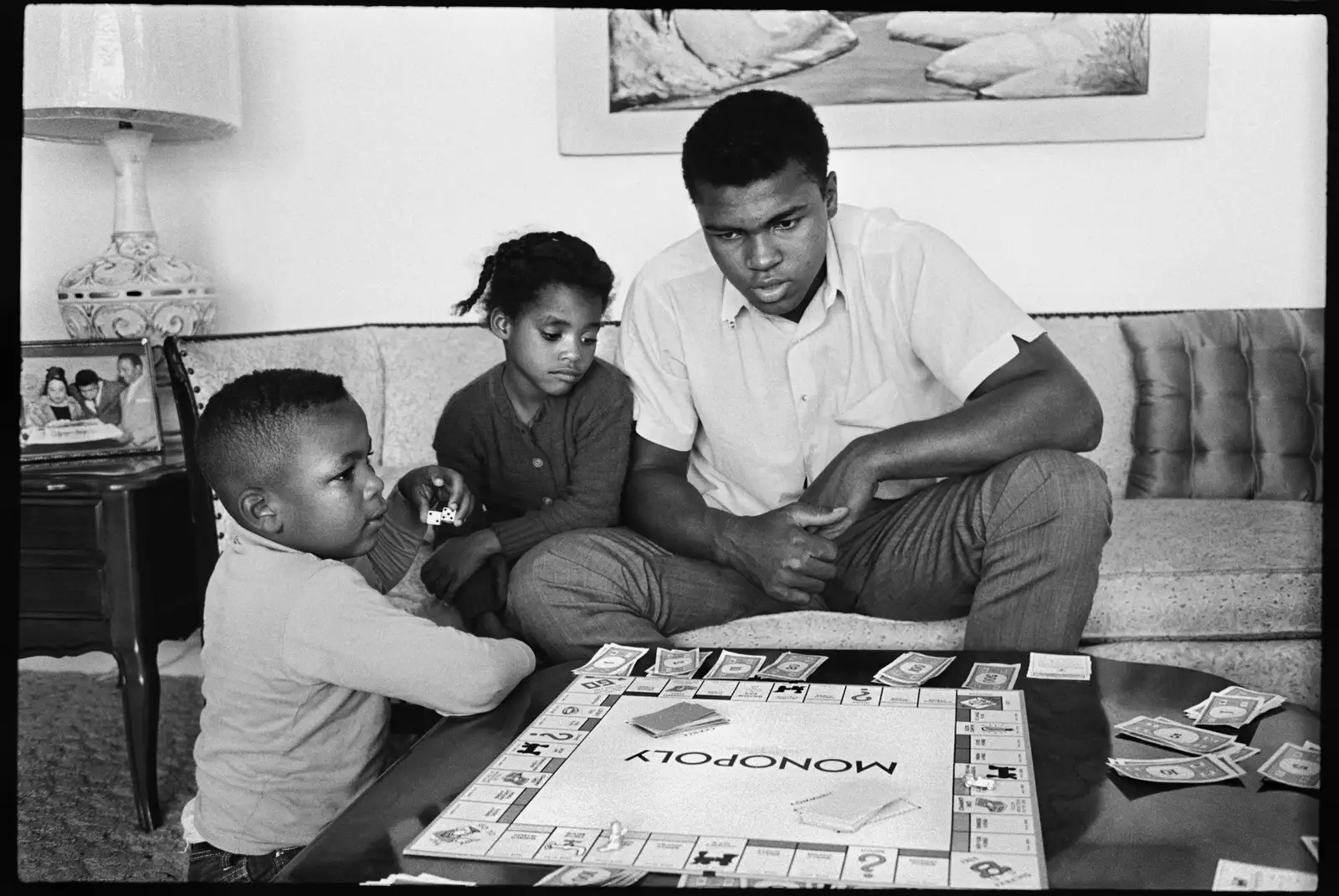 Steve Schapiro, Muhammad Ali (Playing Monopoly with kids), Louisville, KY, 1963