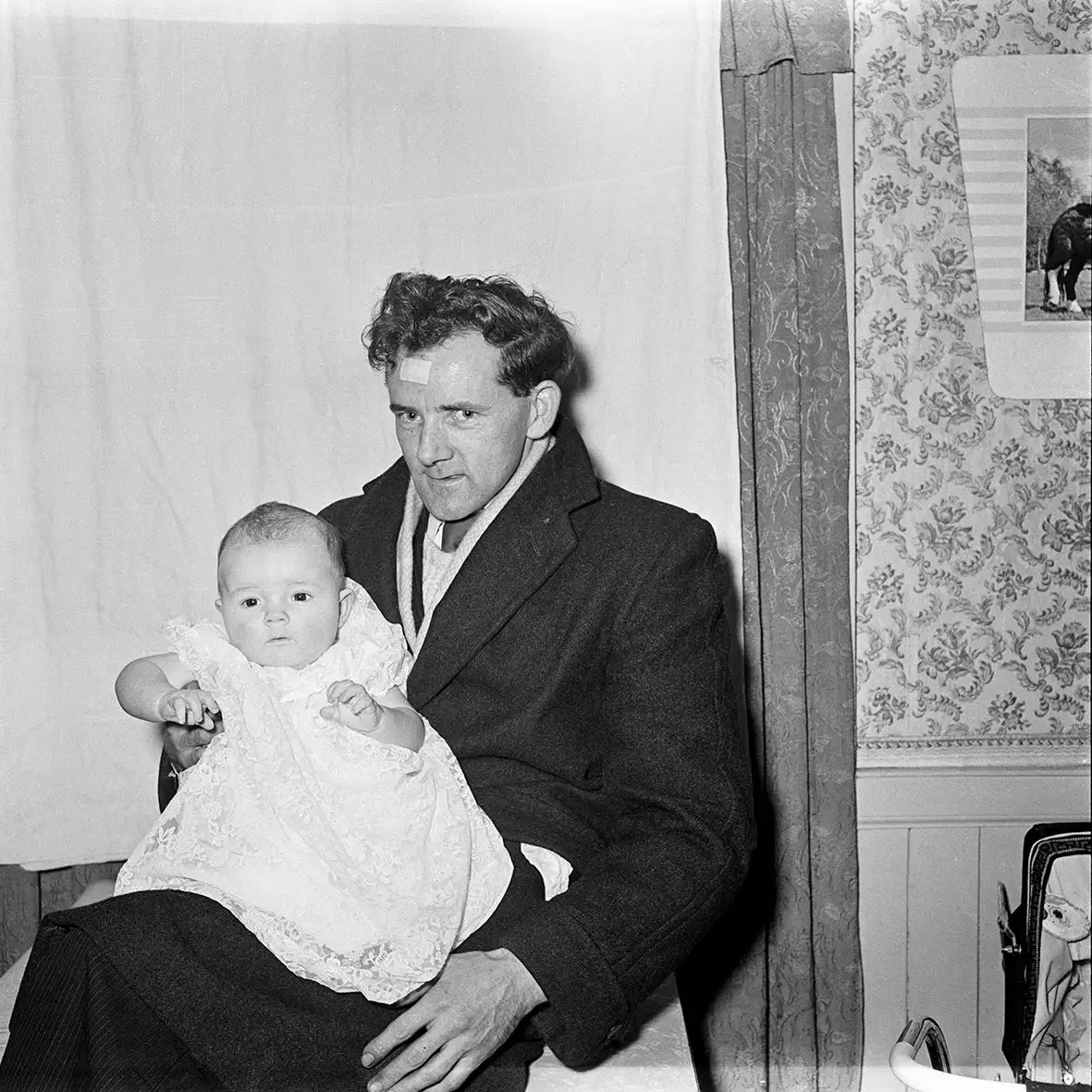 Dennis Dinneen, Untitled (man with bandage and baby), 1950s-1970s