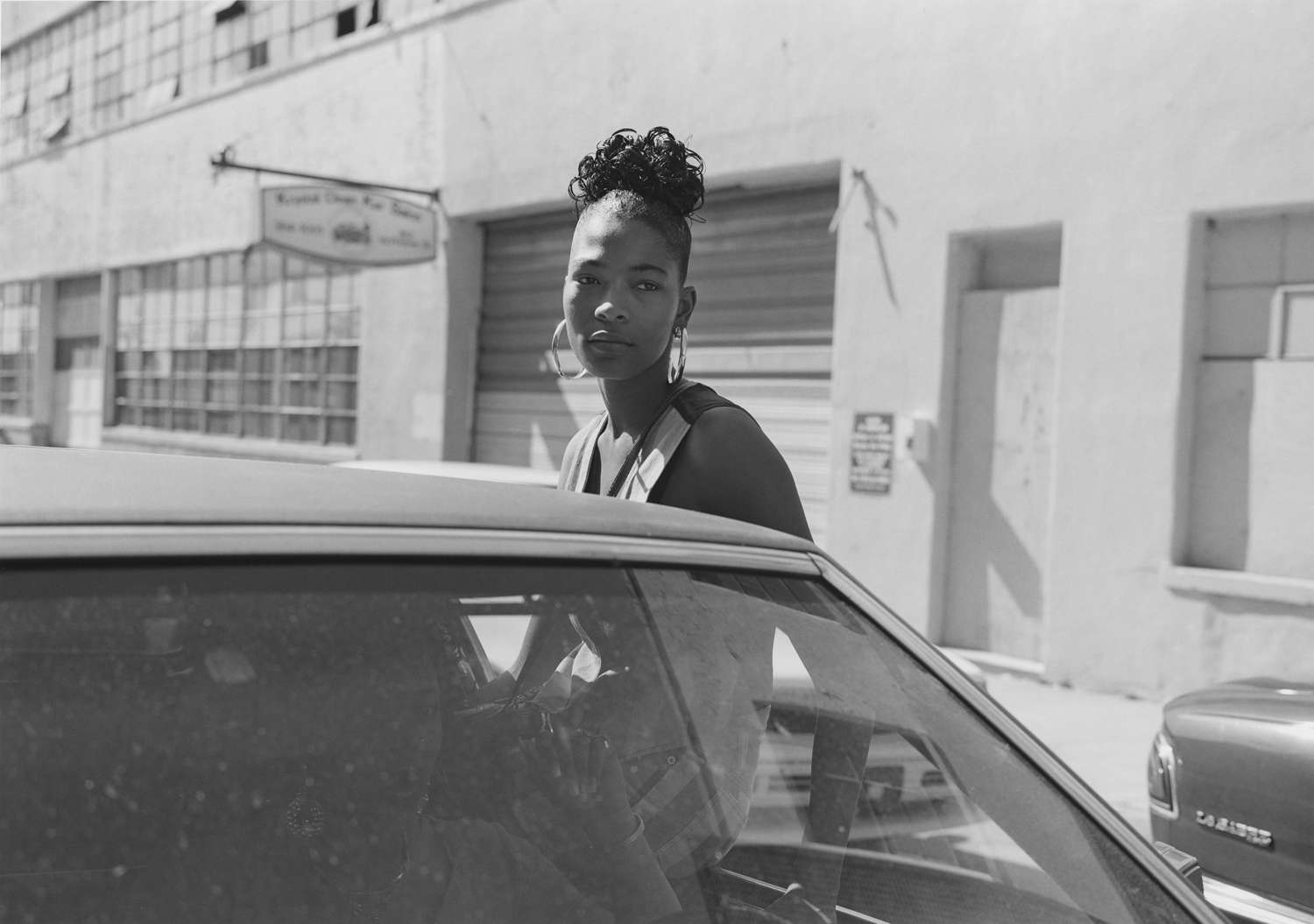 Mark Steinmetz, Atlanta (Girl Sitting on Car Window), 1994