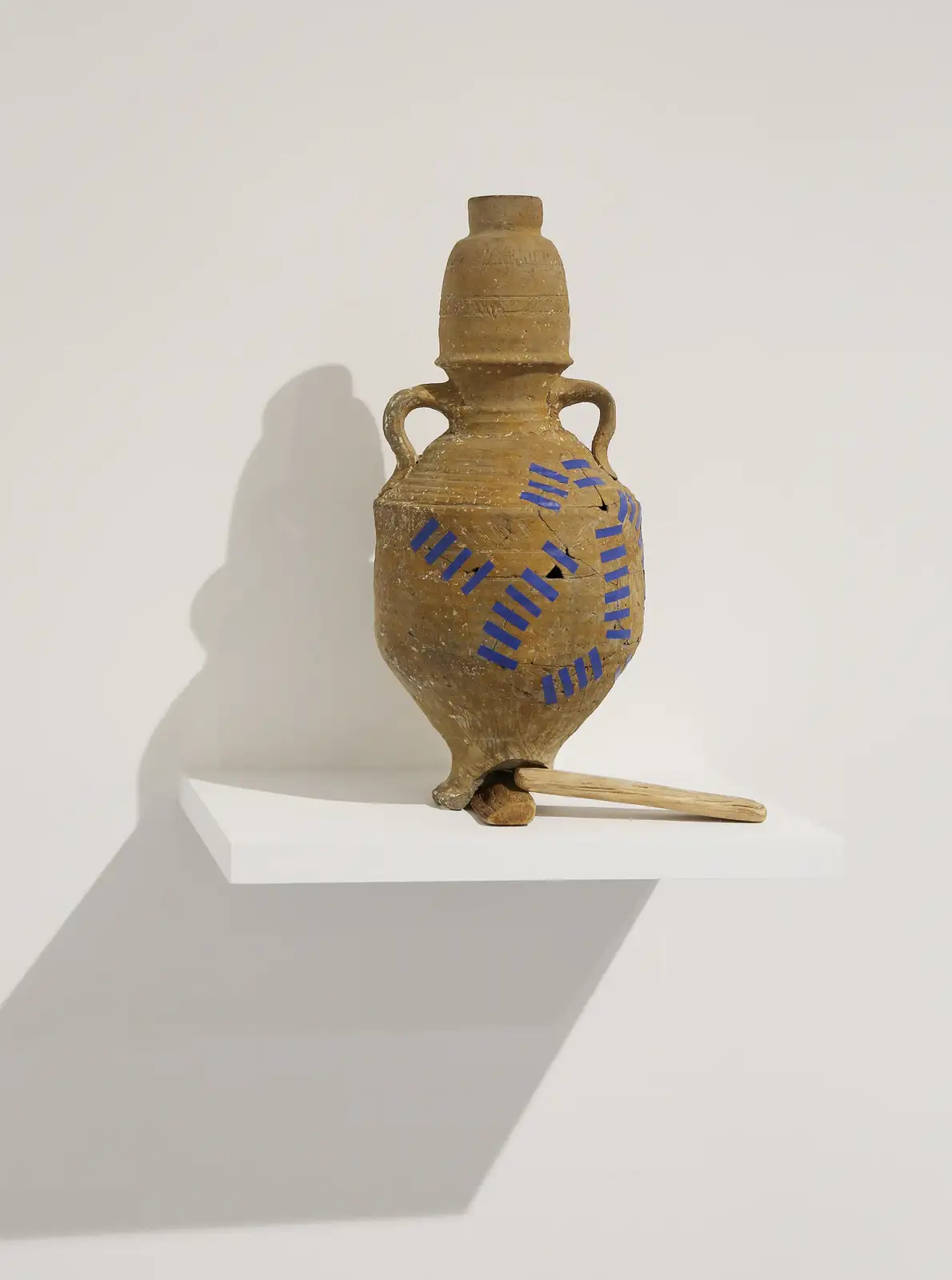 Ali Cherri, 'Grafting E', 2018. Jar with two handles from the Mediterranean Basin 900 1100 AD. Reparation tape wood, 34 X 30 X 20 cm. Courtesy of the artist and Galerie Imane Far&egrave;s, Paris.