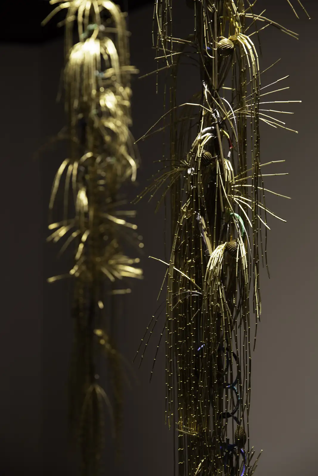 Ahnnlee Lee, 'Alchemy, Transmutation of Matter' (detail), 2023. Yellow copper eyelet, stainless wire, rubber cap, peanut shell, ottchil lacquer, stainless ring, electric cable, Dimensions variable. &copy; ONE AND J. Gallery and the artist.