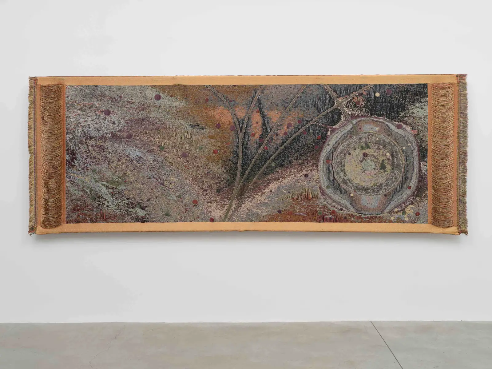 Otobong Nkanga, 'Sunburst', 2024. Woven textile, 130 x 356 x 2 cm © Otobong Nkanga, Courtesy Lisson Gallery.