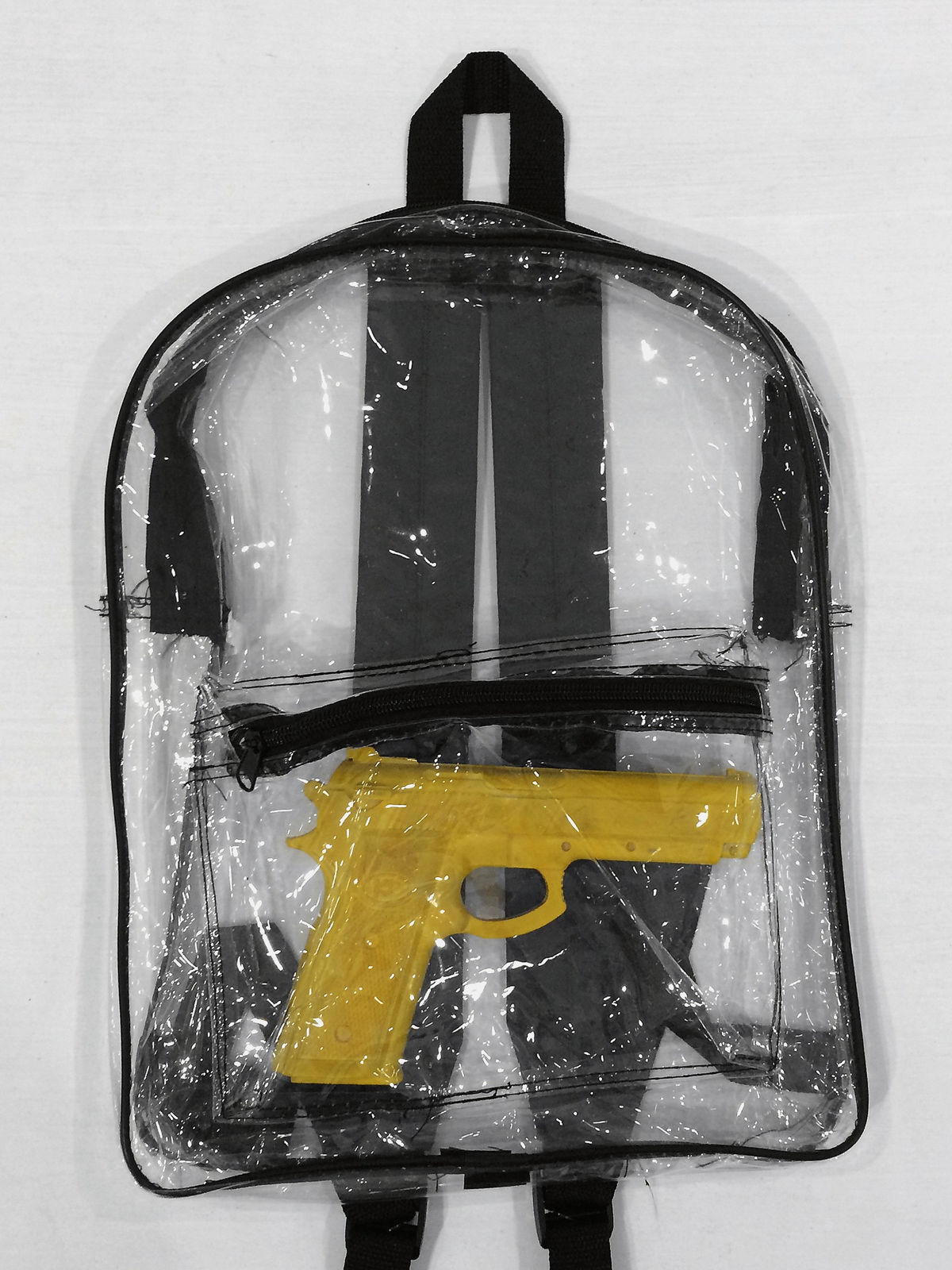 Arash Fayez, Toy gun in backpack, 2014