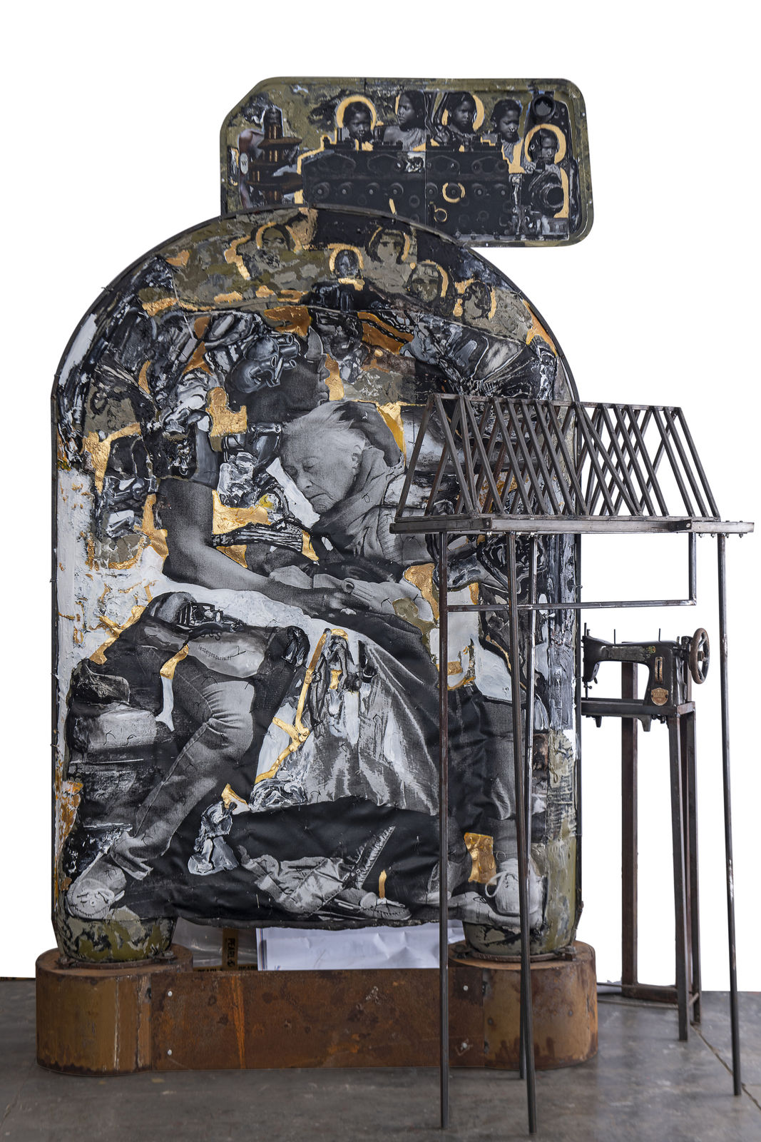 A mix media installation of quilt, iron oxide and photograph titled The Raft: In Memory of Gericault and Noah, painted by contemporary Indian artist Probir Gupta