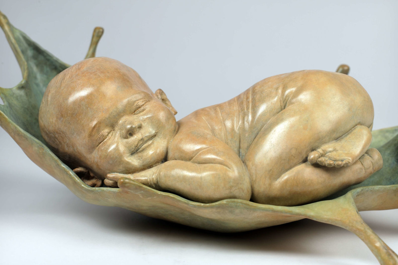 sweet dreams baby sculpture Liang Binbin cute baby sleeping on blue water bronze sculpture contemporary sculpture Art Yi gallery Brussels art gallery