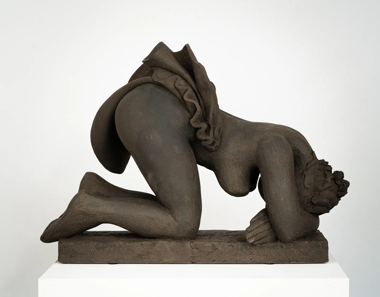 Figurative ceramics sculpture by artist Emilio DiIorio. Female figure is No. 5 in artist's Seated Bathers series in black clay.
