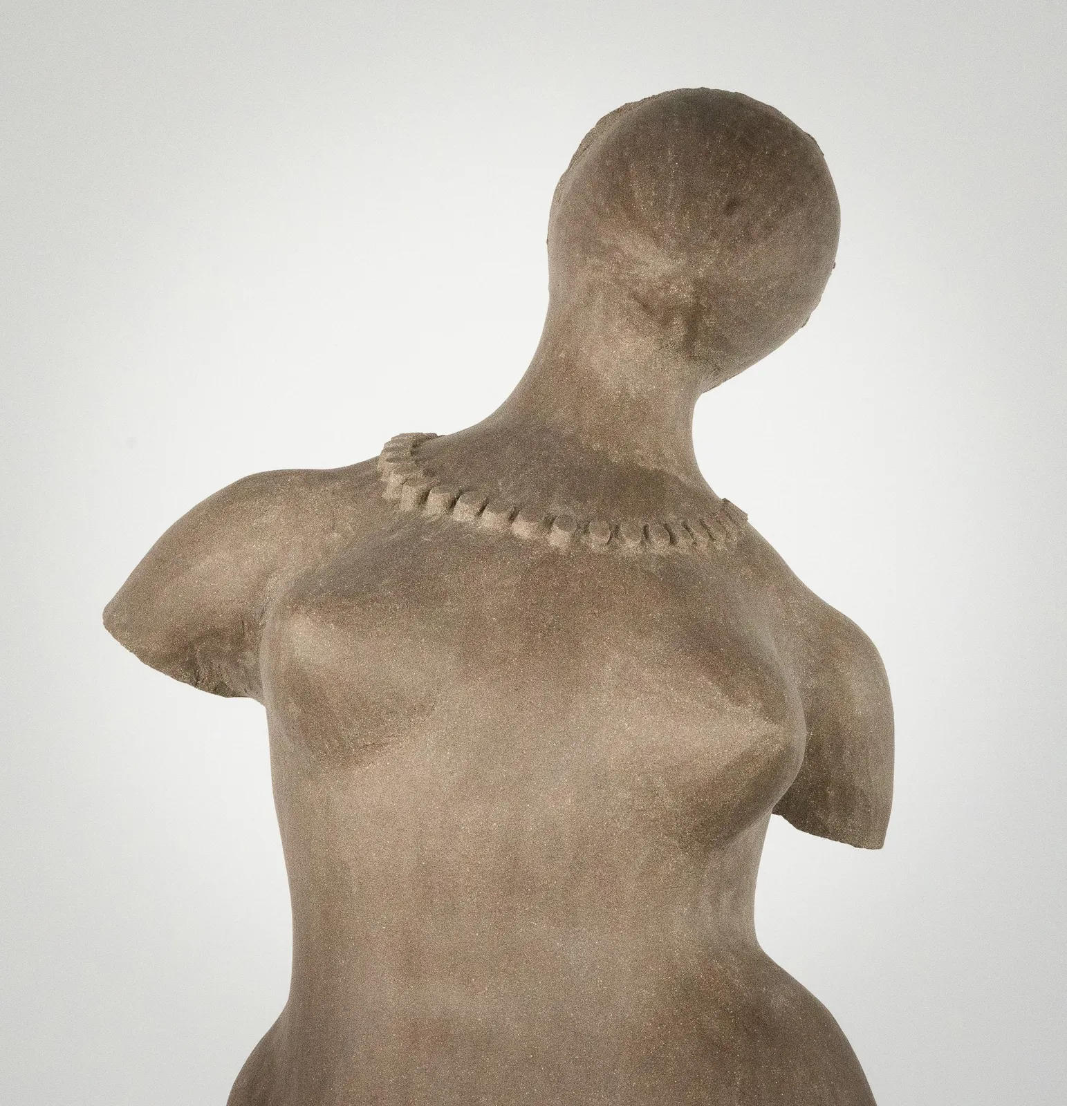 Figurative ceramic sculpture by artist Emilio DiIorio. Female figure is No. 3 in artist's The Dance series in gray clay.