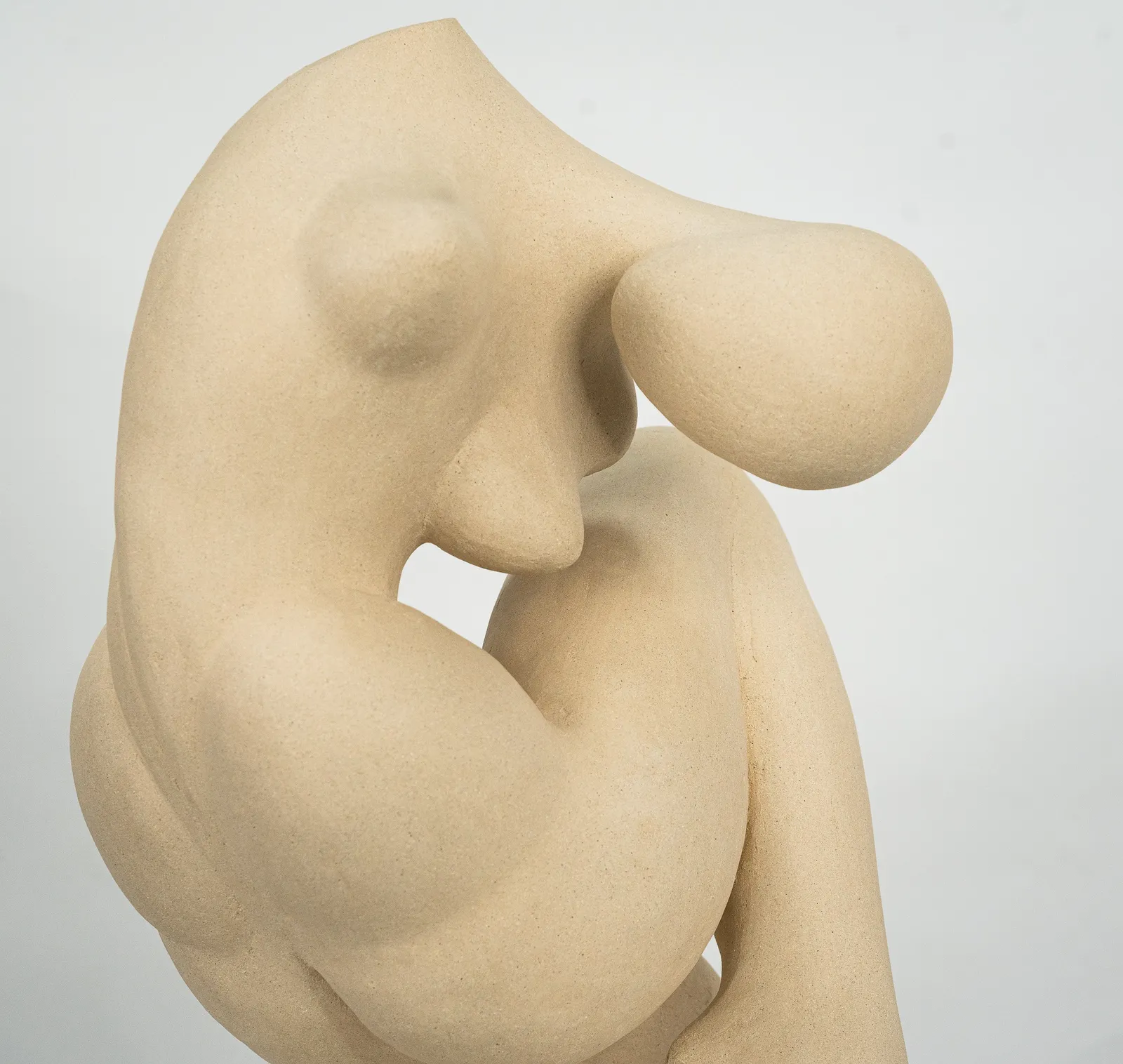 Figurative sculpture in white clay by artist Emilio DiIorio. Crouching figure is No. 2 in artist's Fragmented Aphrodite series.