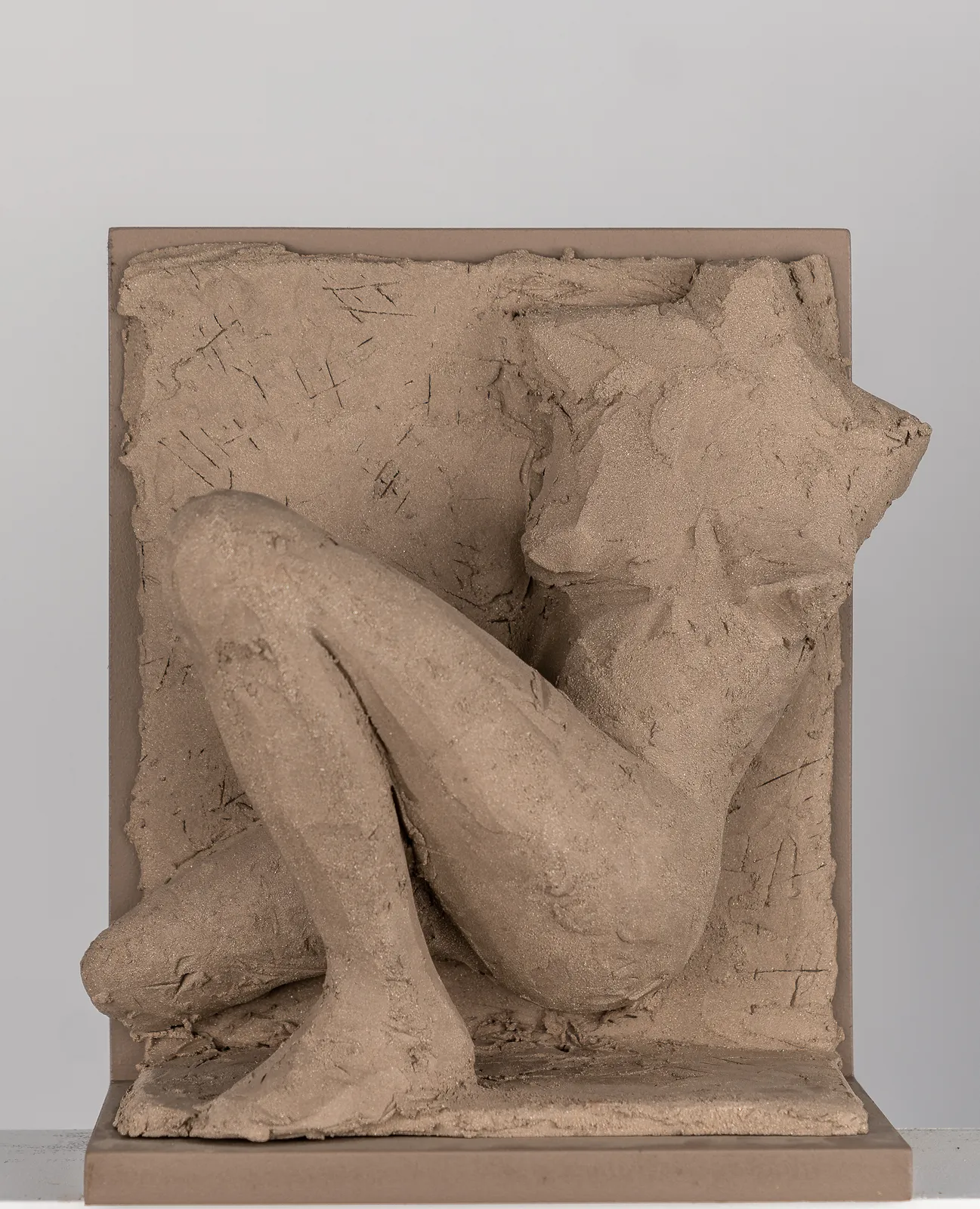 Figurative ceramic relief by artist Emilio DiIorio in Women of Troy series in gray clay.