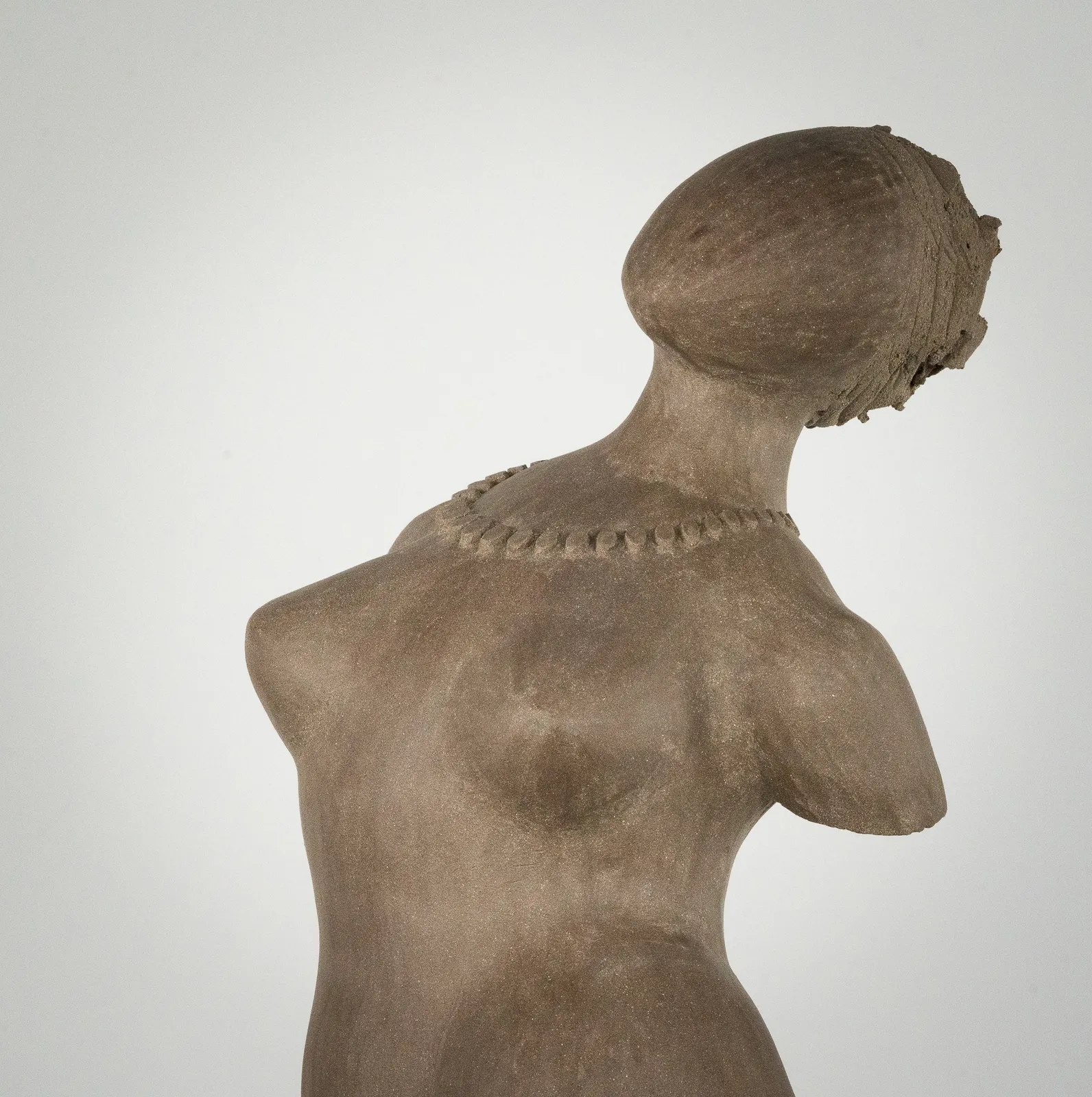 Figurative ceramic sculpture by artist Emilio DiIorio. Female figure is No. 3 in artist's The Dance series in gray clay.