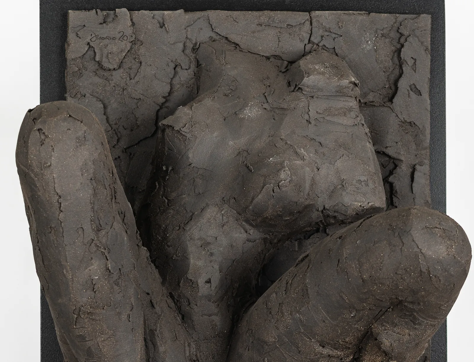 Ceramic relief in black clay in sculptor Emilio DiIorio's Women of Troy series.