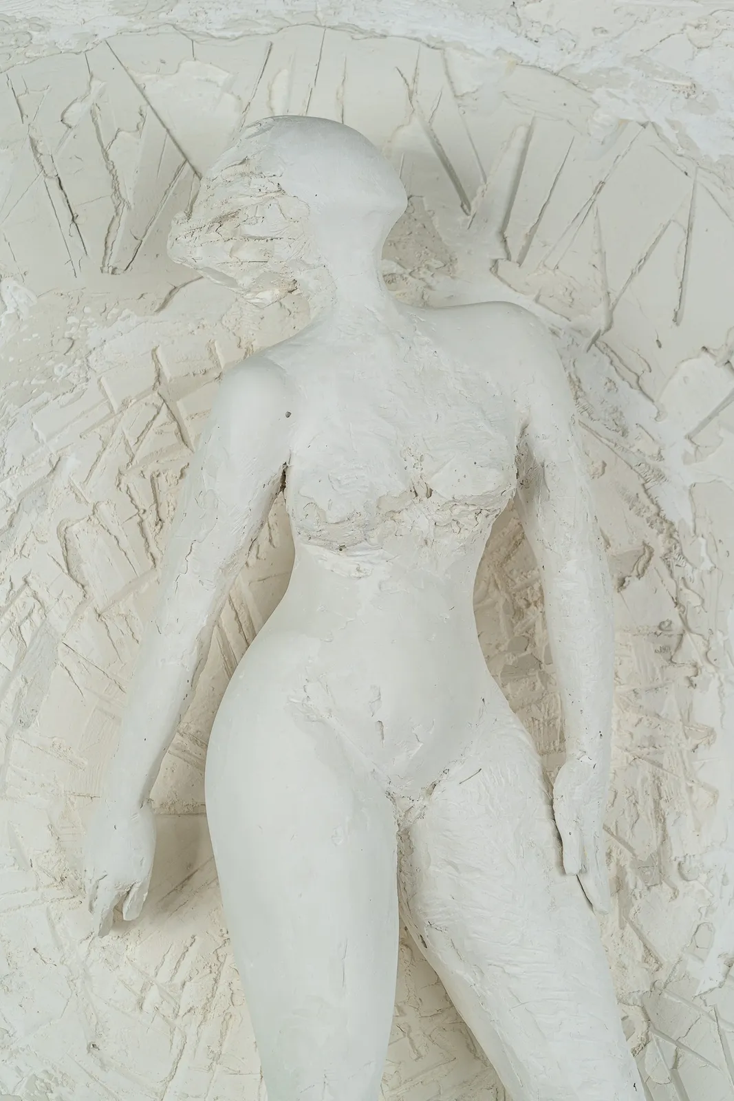 Female figurative relief in plaster by contemporary artist Emilio DiIorio. Relief is No. 4 in artist's Greek Muses series.