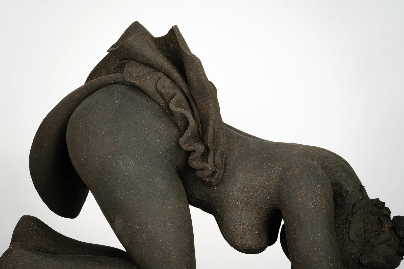Figurative ceramics sculpture by artist Emilio DiIorio. Female figure is No. 5 in artist's Seated Bathers series in black clay.