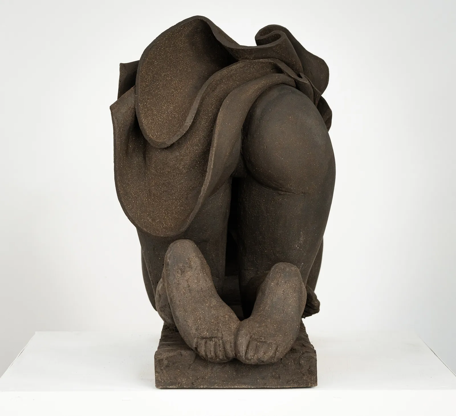 Figurative ceramics sculpture by artist Emilio DiIorio. Female figure is No. 5 in artist's Seated Bathers series in black clay.