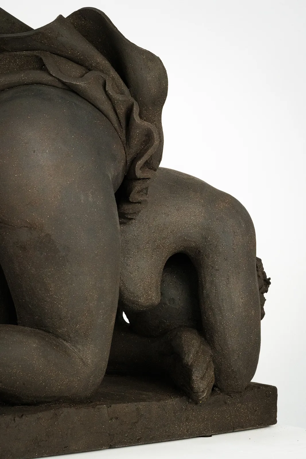 Figurative ceramics sculpture by artist Emilio DiIorio. Female figure is No. 5 in artist's Seated Bathers series in black clay.