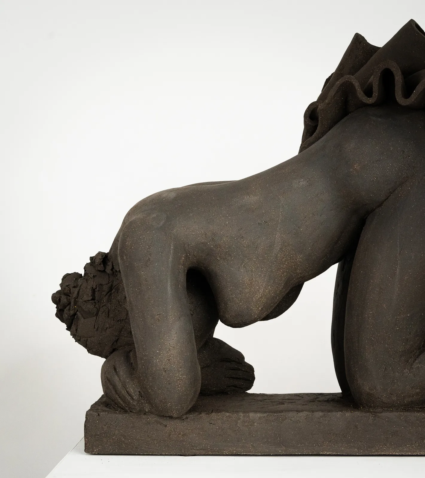 Figurative ceramics sculpture by artist Emilio DiIorio. Female figure is No. 5 in artist's Seated Bathers series in black clay.