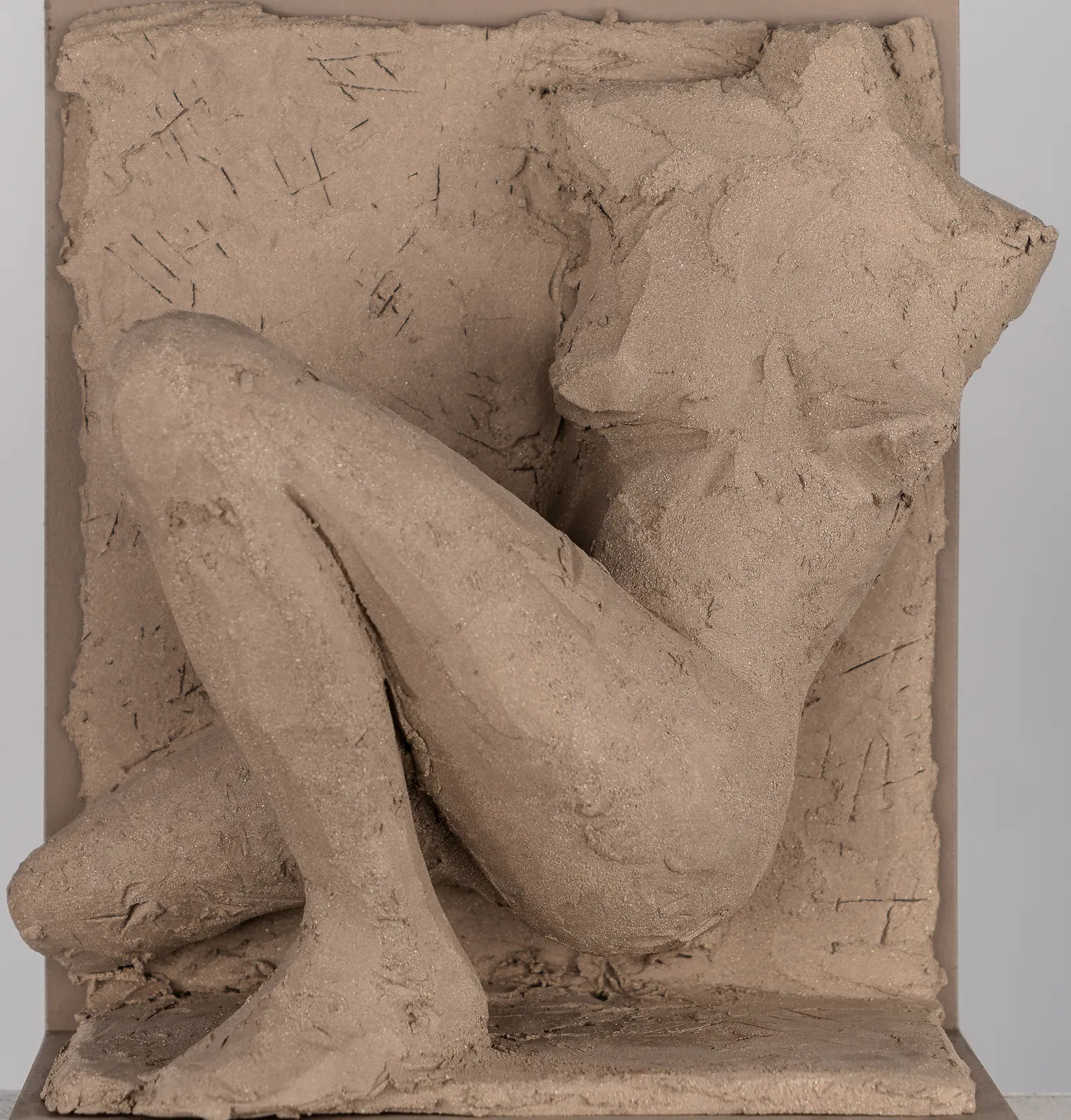 Figurative ceramic relief by artist Emilio DiIorio in Women of Troy series in gray clay.