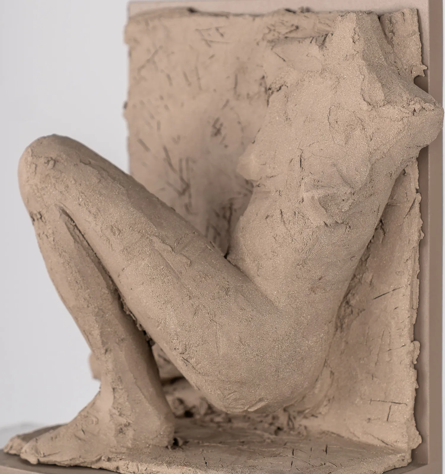 Figurative ceramic relief by artist Emilio DiIorio in Women of Troy series in gray clay.