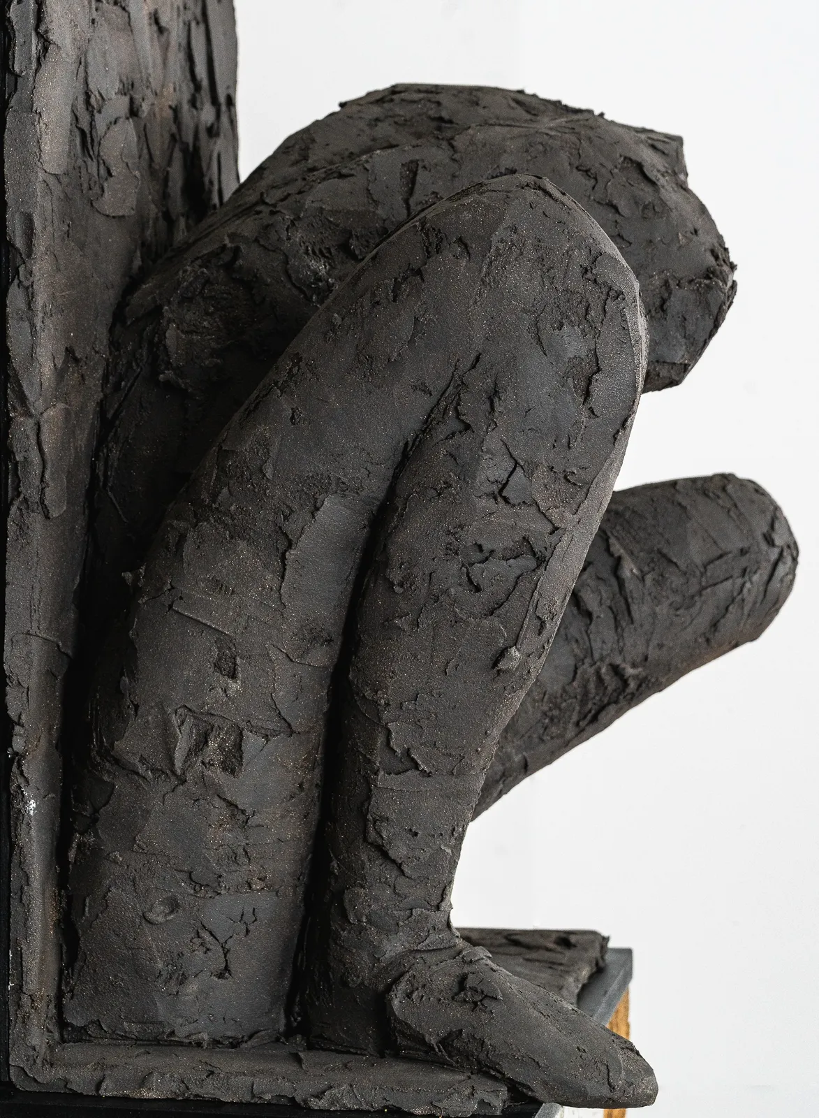 Ceramic relief in black clay in sculptor Emilio DiIorio's Women of Troy series.