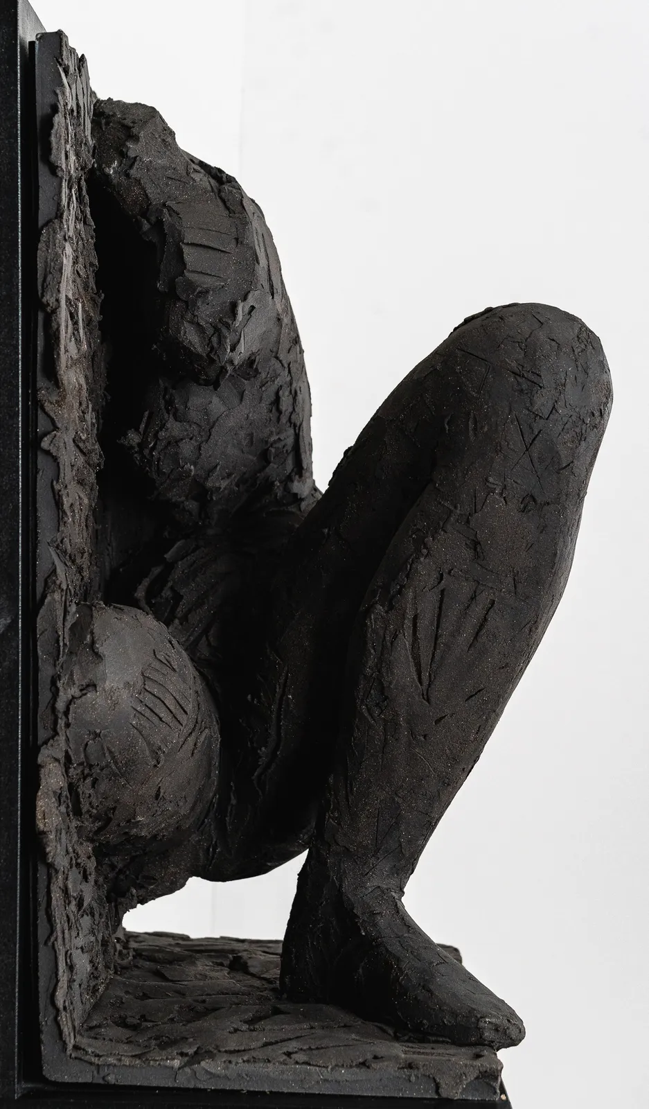 Ceramic relief in black clay in sculptor Emilio DiIorio's Women of Troy series.