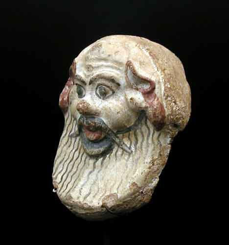 Etruscan terracotta antefix with satyr's head, 500 BCE - 400 BCE