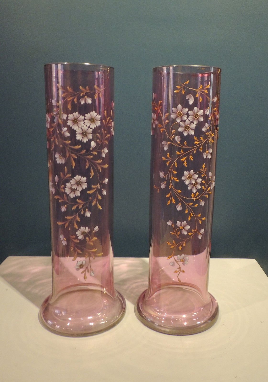 Pair of lilac glass tubular vases with floral decoration