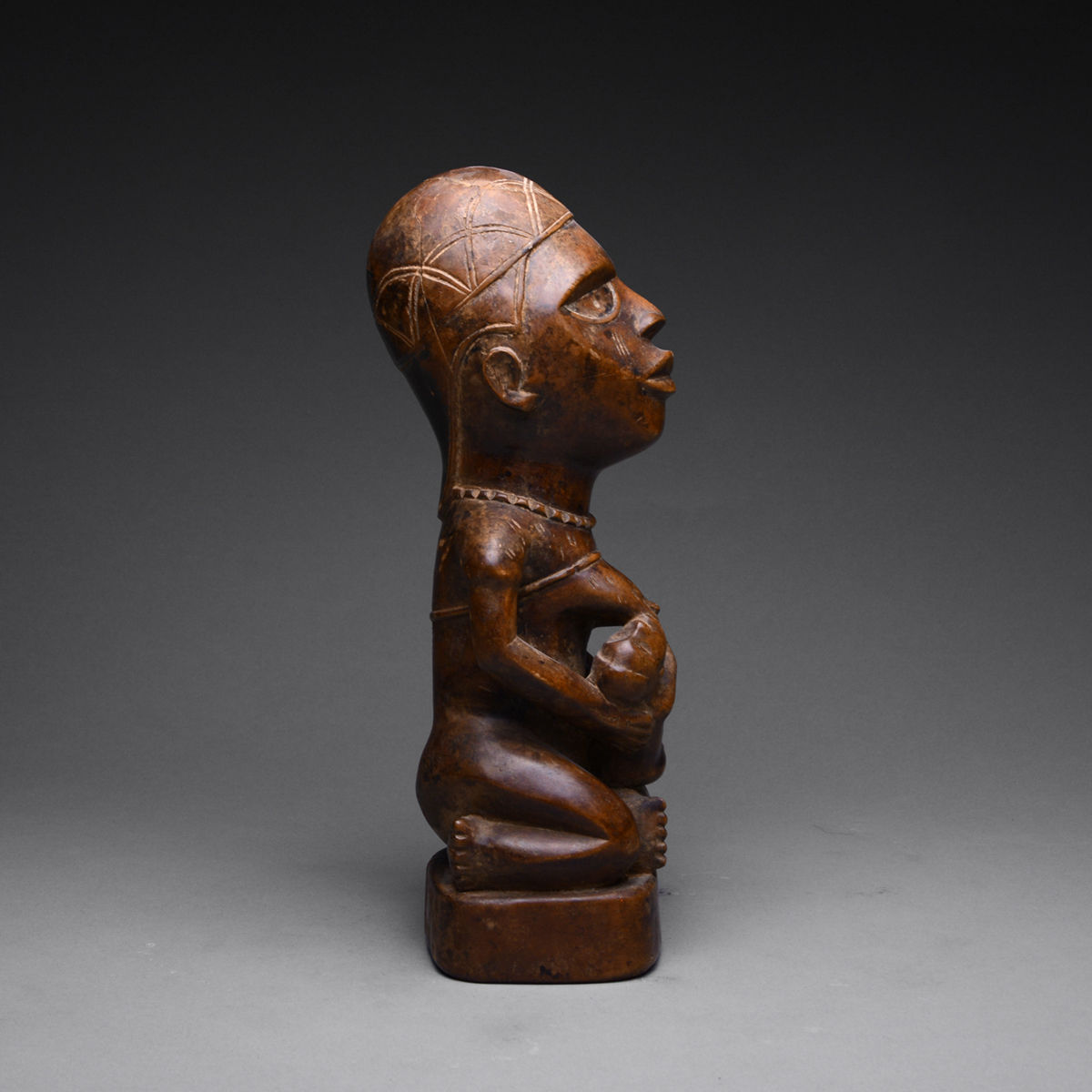 Yombe Wooden Pfemba Sculpture of a Mother and Child, 20th Century CE