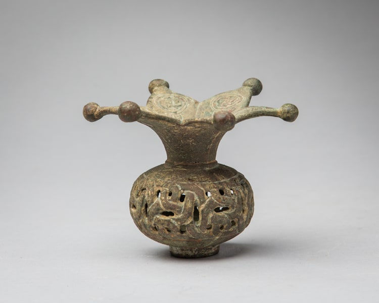Minute reticulated incense burner in the shape of a pomegranate, 900 CE - 1200 CE