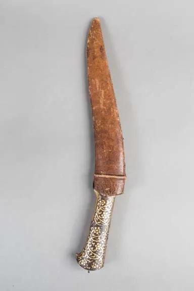 Curved knife with damascened hilt