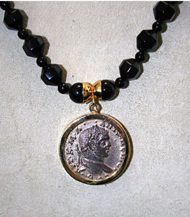 Tetradrachm of the Roman Emperor Caracalla in beaded necklace, 198 CE - 217 CE